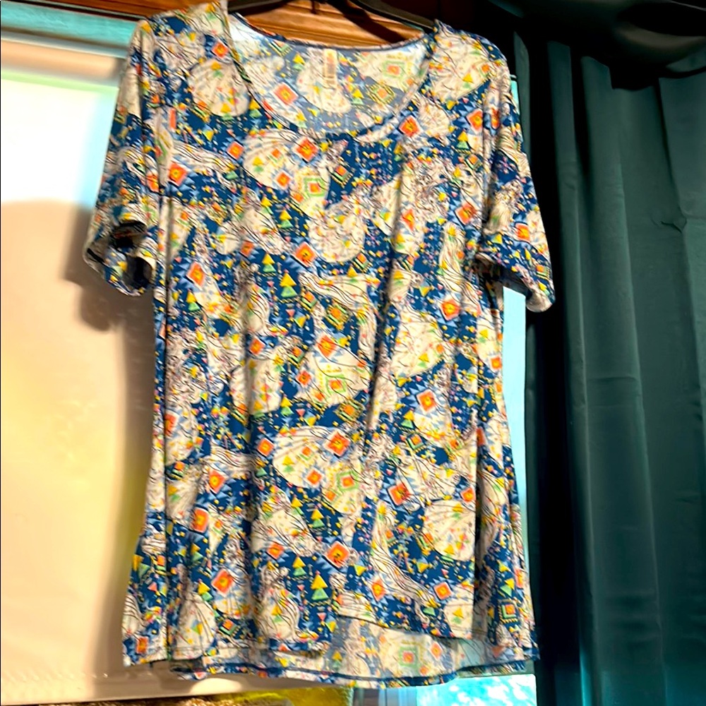 LuLaRoe Cream and Blue Graphic Relaxed Tee, Disney princess print.